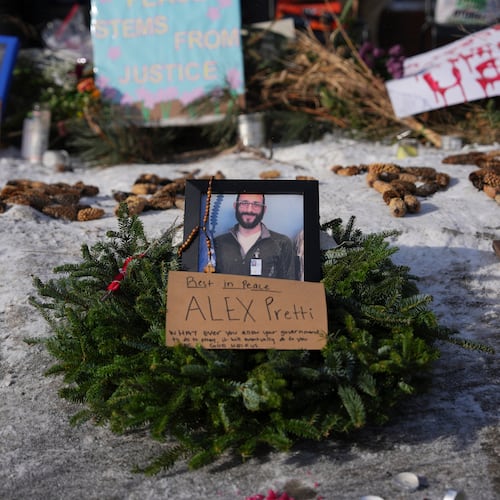 A makeshift memorial is placed where Alex Pretti was fatally shot by a U.S. Border Patrol officer yesterday, in Minneapolis, Sunday, Jan. 25, 2026. (Adam Gray/AP)