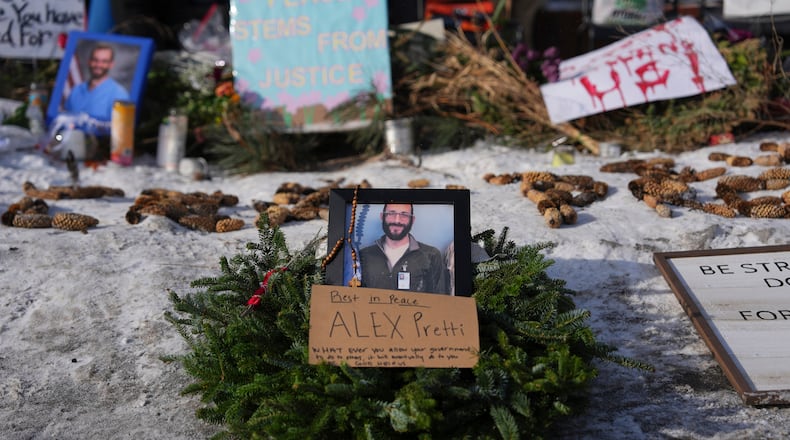 A makeshift memorial is placed where Alex Pretti was fatally shot by a U.S. Border Patrol officer yesterday, in Minneapolis, Sunday, Jan. 25, 2026. (Adam Gray/AP)