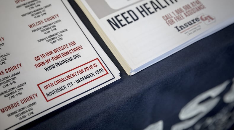 After steep price increases that health insurance companies attributed to turmoil from the Trump administration’s attempts to dismantle the Affordable Care Act, premiums for plans on the exchange market are set to decrease in Georgia in 2019. In this photo, Insure Georgia representatives in Macon offer information about ACA plans during open enrollment in 2017. (PHOTO by Audra Melton/The New York Times)
