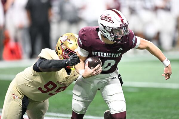 Creekside defensive tackle Daniel Holt (left) sacks Benedictine quarterback Stephen Cannon during the Class 4A state championship game in December at Mercedes-Benz Stadium in Atlanta. (Daniel Varnado for the AJC 2025)