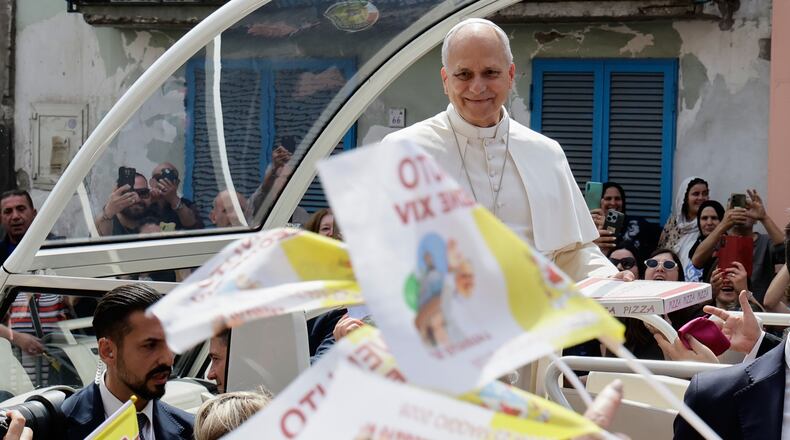 Pope Leo XIV rides on his popemobile during his one-day pastoral visit in Acerra, Italy, Saturday, May 23, 2026. (AP Photo/Salvatore Laporta)