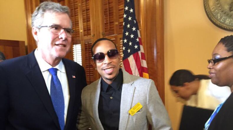 Jeb Bush posing with Ludacris during his visit to the Georgia statehouse.