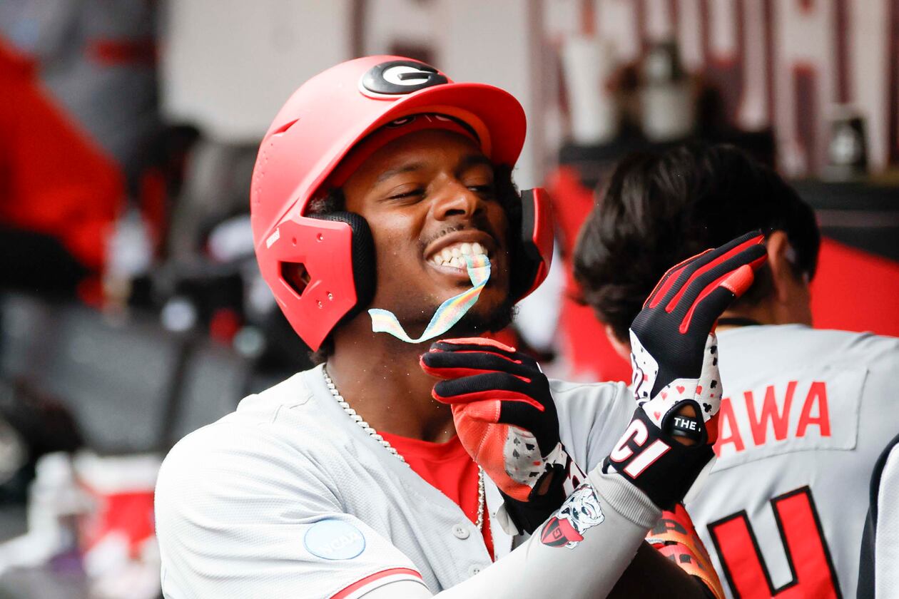Georgia Bulldogs infielder Tre Phelps receives sour candy after scoring a run at Foley Field on Sunday, June 7, 2026, in Athens. This year, the Bulldogs won the SEC Tournament title for the first time in program history. (Miguel Martinez/AJC)
