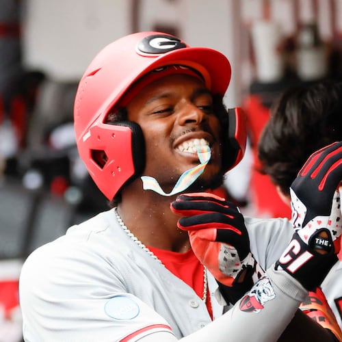 Georgia Bulldogs infielder Tre Phelps receives sour candy after scoring a run at Foley Field on Sunday, June 7, 2026, in Athens. This year, the Bulldogs won the SEC Tournament title for the first time in program history. (Miguel Martinez/AJC)