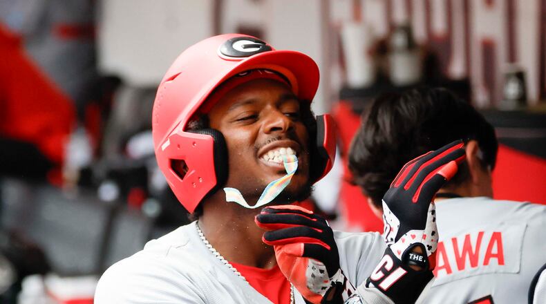 Georgia Bulldogs infielder Tre Phelps receives sour candy after scoring a run at Foley Field on Sunday, June 7, 2026, in Athens. This year, the Bulldogs won the SEC Tournament title for the first time in program history. (Miguel Martinez/AJC)