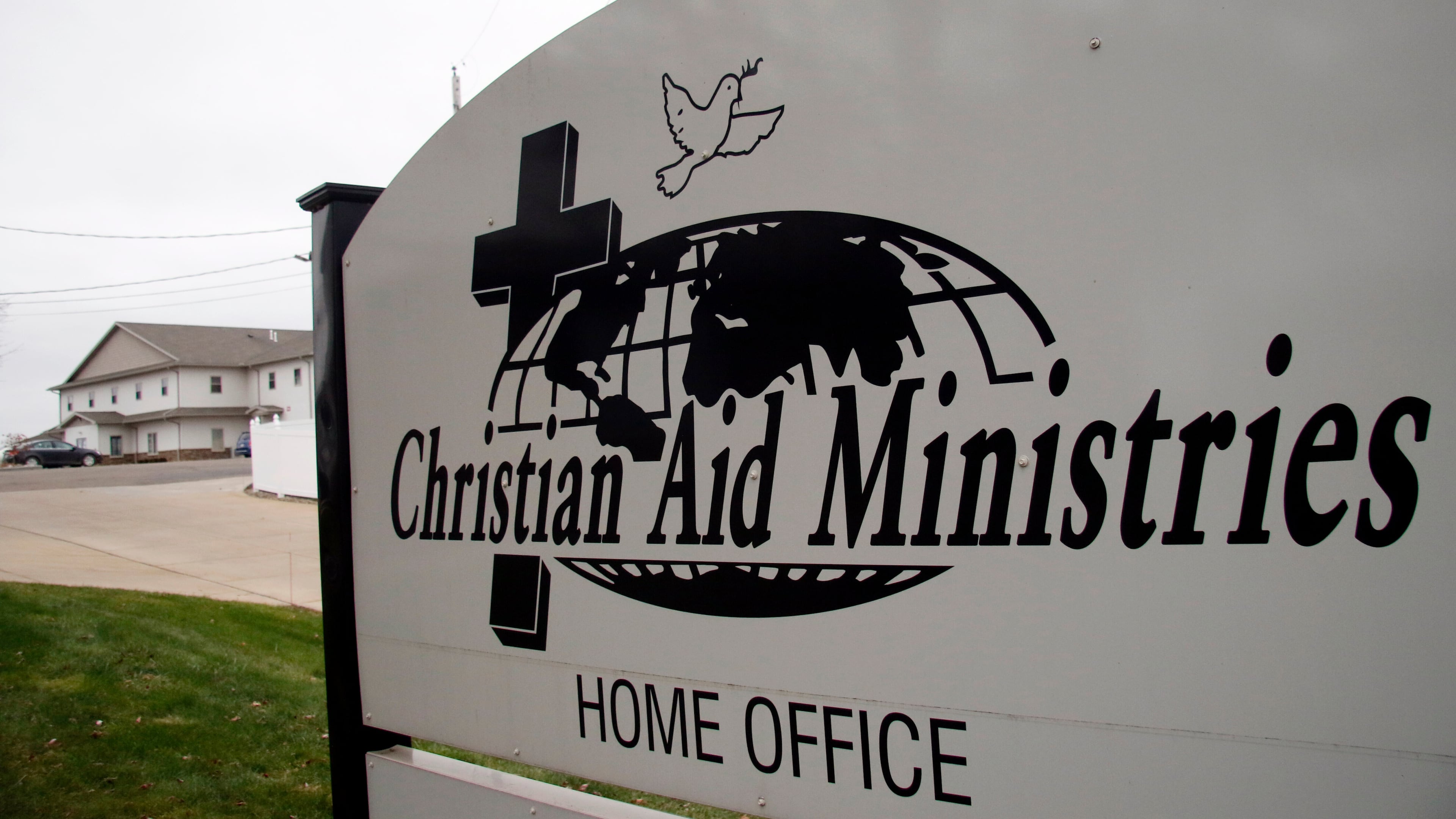 FILE - A sign for the Christian Aid Ministries offices is seen in Berlin, Ohio, Dec. 16, 2021. (AP Photo/Tom E. Puskar, File)
