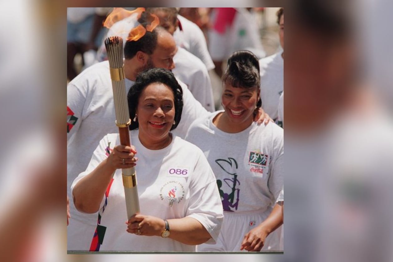 Coretta Scott King carries the Olympic torch Friday, July 19, 1996 prior to the 1996 Summer Olympic Games in Atlanta, Georgia (Cox staff photo/Greg Lovett) 07/19/96