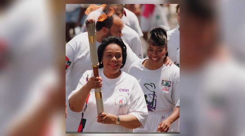 Coretta Scott King carries the Olympic torch Friday, July 19, 1996 prior to the 1996 Summer Olympic Games in Atlanta, Georgia (Cox staff photo/Greg Lovett) 07/19/96