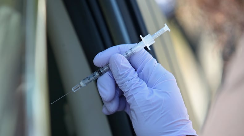 Henry Schools appoints local doctor to be medical examiner on COVID-19 distribution. (John McCall/South Florida Sun-Sentinel/TNS)