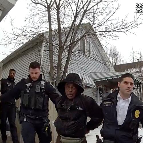 This image from body camera video provided by the Buffalo Police Department shows Nurul Amin Shah Alam, center, led by Buffalo Police officers after being arrested on charges of assault, burglary and criminal mischief in Buffalo, N.Y., on Feb. 15, 2025. (Buffalo Police Department via AP)