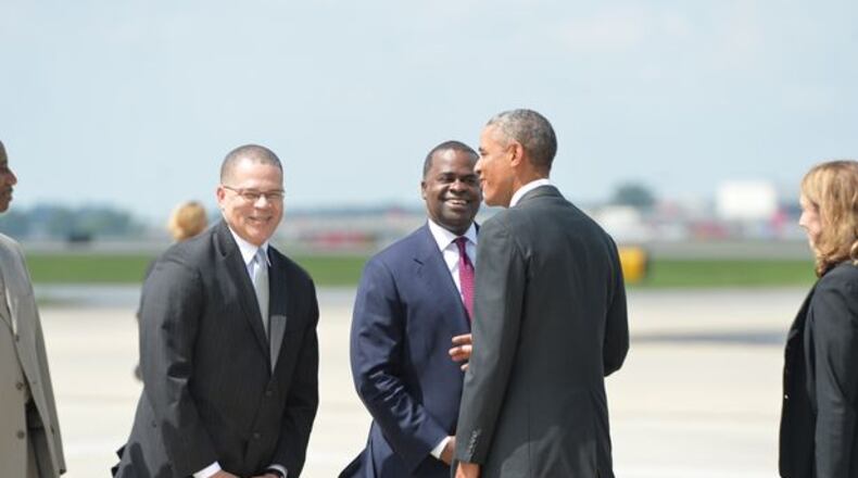 President Obama was greeted by Fulton County chair John Eaves and Atlanta Mayor Kasim Reed upon his arrival in Atlanta.