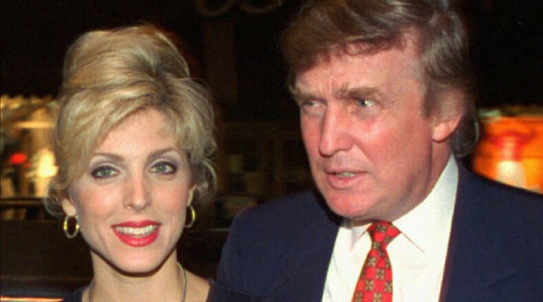 Donald Trump and his wife, Marla Maples, are shown in an August 1994 file photo. (AP Photo/John Bazemore, File)