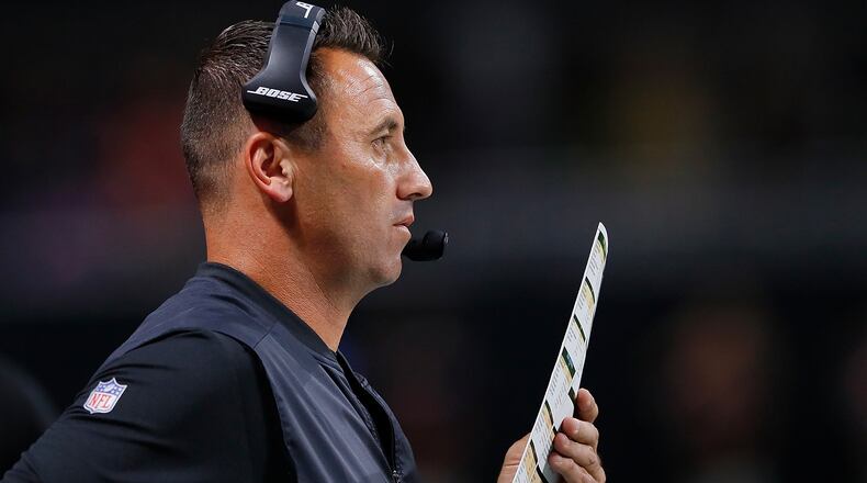 Falcons offensive coordinator Steve Sarkisian calls plays from the sidelines at Mercedes-Benz Stadium.