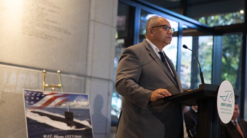 U.S. Secretary of the Navy Carlos Del Toro announces the branch's newest Virginia-class nuclear-powered submarine will be named the USS Atlanta during a ceremony at the Jimmy Carter Presidential Library and Museum on Oct. 23, 2024. Riley Bunch/AJC