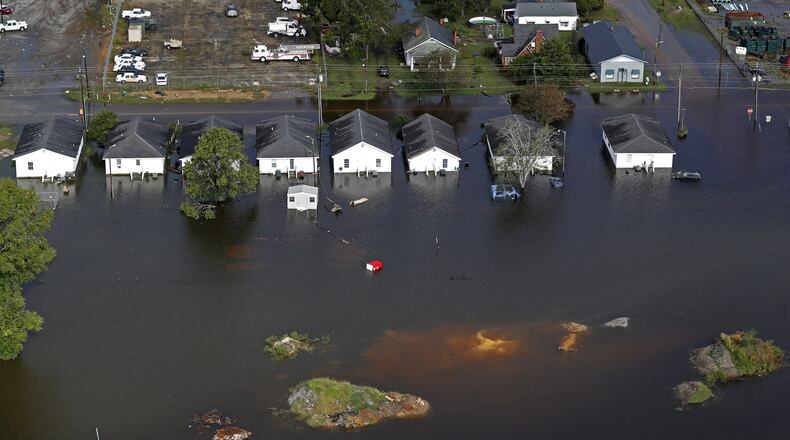 Floodwater from Hurricane Florence threatens homes in Dillon, S.C., Monday, Sept. 17, 2018. (AP Photo/Gerald Herbert)