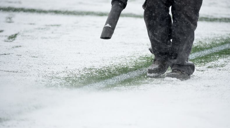 MINNEAPOLIS, MN - MARCH 12: A crew member melts the snow on the lines during a break in the action in the first half of the match between the Minnesota United FC and the Atlanta United FC on March 12, 2017 at TCF Bank Stadium in Minneapolis, Minnesota. (Photo by Hannah Foslien/Getty Images)