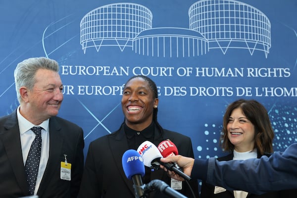South Africa's Caster Semenya, center, answers reporters with lawyers Gregory Nott, left, and Shona Jolly KC after Semenya won a partial victory at the European Court of Human Rights on in her seven-year legal fight against track and field's sex eligibility rules, Thursday, July 10, 2025 in Strasbourg, eastern France. (AP Photo/Antonin Utz)