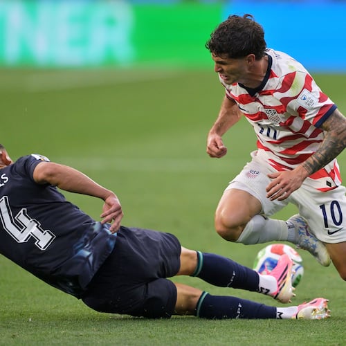 Paraguay's Juan Jose Caceres (4) tackles United States' Christian Pulisic (10) during the World Cup Group D soccer match in Inglewood, Calif., near Los Angeles, Friday, June 12, 2026. (AP Photo/Jayne Kamin-Oncea)