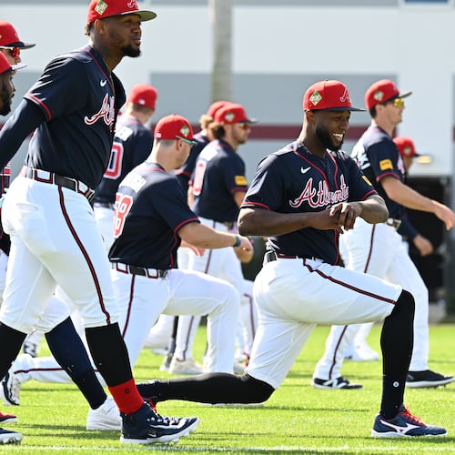 Atlanta Braves outfielder Jurickson Profar (center) warms up during the first full-squad spring training workouts at CoolToday Park, Sunday, Feb. 15, 2026, in North Port, Fla. (Hyosub Shin/AJC)