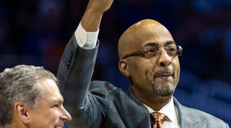Former Orlando Magic player Dennis Scott, known as 3D, is inducted into the Orlando Magic Hall of Fame by CEO Alex Martins during the first half of the Orlando Magic vs. New York Knicks NBA basketball game, Thursday, March 23, 2023, in Orlando, Fla. (AP Photo/Kevin Kolczynski)