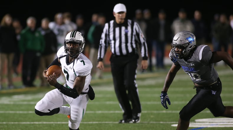 Roswell High School quarterback Malik Willis (7) runs the ball while being pursued by a Westlake High School player during the first half of a semi-final high school football game, Friday, Dec. 2, 2016, in Atlanta. Branden Camp/Special