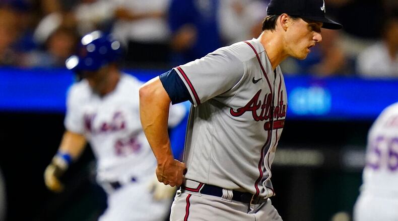 Atlanta Braves starting pitcher Kyle Wright waits as New York Mets' Tyler Naquin runs the bases after hitting a home run during the sixth inning of a baseball game Thursday, Aug. 4, 2022, in New York. (AP Photo/Frank Franklin II)