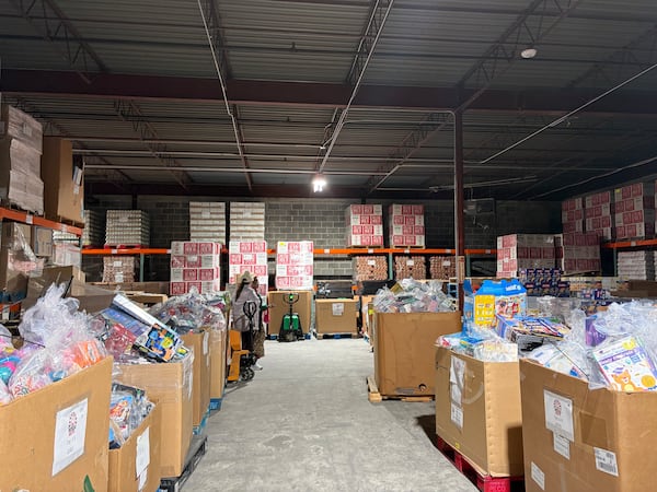 Baskets filled with toys await partygoers at Hosea Helps. This year, before it even began, there was a line of families down the street. (Morayo Ogunbayo/AJC)