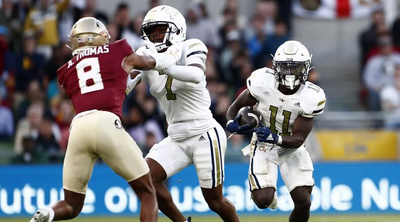 Jamal Haynes (11) scored two touchdowns as Georgia Tech rushed for 190 yards in its 24-21 victory over Florida State.