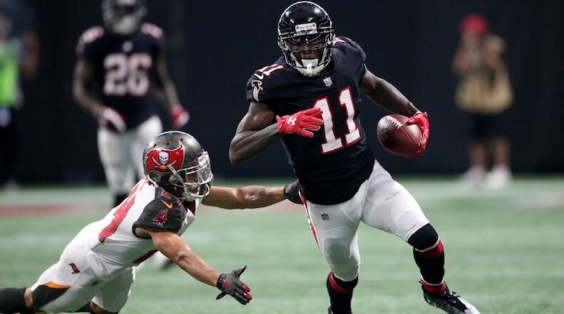 Atlanta Falcons wide receiver Julio Jones (11) runs against Tampa Bay Buccaneers cornerback Brent Grimes (24) during the second half of an NFL football game, Sunday, Nov. 26, 2017, in Atlanta. (AP Photo/John Bazemore)