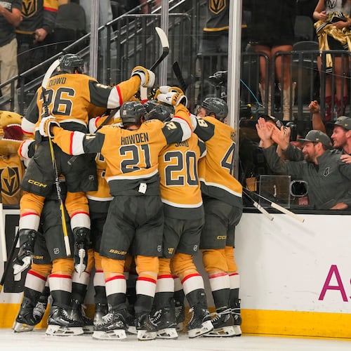 The Vegas Golden Knights celebrate defeating the Anaheim Ducks during overtime of Game 5 of a second-round NHL hockey Stanley Cup playoff series Tuesday, May 12, 2026, in Las Vegas. (AP Photo/Candice Ward)