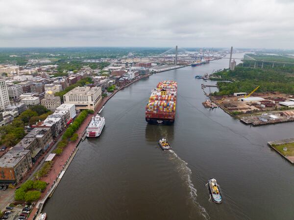 Aerial view of historic Savannah Georgia town and Savannah River shows two tug boats and ocean cargo ship with containers. (Photo by: Joe Sohm/Visions of America/UCG/Universal Images Group via Getty Images)