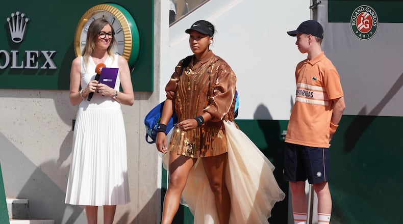 Naomi Osaka of Japan enters the court for the second round women's singles tennis match against Donna Vekic of Croatia at the French Open tennis tournament in Paris, Thursday, May 28, 2026. (AP Photo/Thibault Camus)