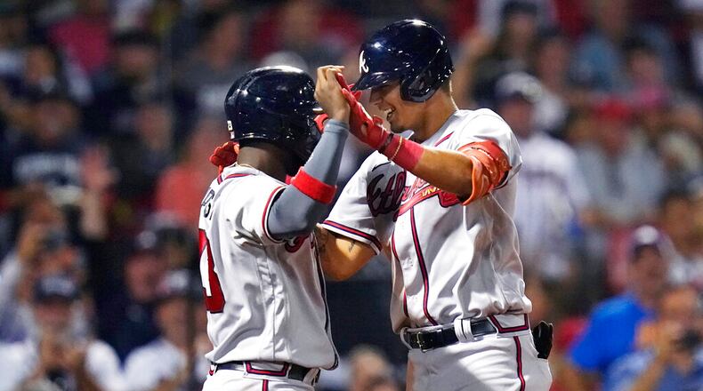 Atlanta Braves' Vaughn Grissom, right, is congratulated by Michael Harris II after his two-run home run against the Boston Red Sox during the seventh inning of a baseball game Wednesday, Aug. 10, 2022, in Boston. (AP Photo/Charles Krupa)