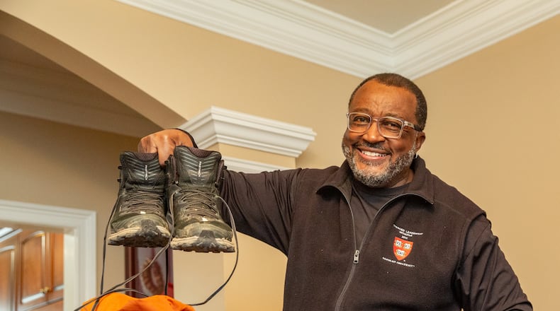 C. David Moody, Jr. preparing to leave for his trek up Mount Kilimanjaro with Morehouse President Thomas. (Jenni Girtman for Atlanta Journal-Constitution)