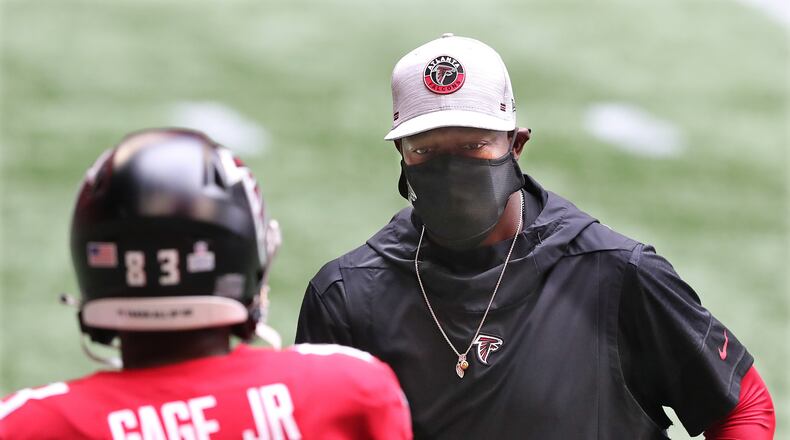 102520 Atlanta: Falcons head coach Raheem Morris and wide receiver Russell Gage prepare to face the Detroit Lions Sunday, Oct 25, 2020, at Mercedes-Benz Stadium in Atlanta. (Curtis Compton / Curtis.Compton@ajc.com)