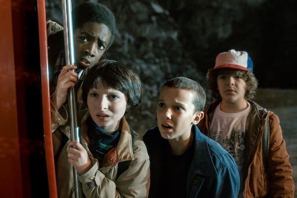 Caleb McLaughlin (from left), Finn Wolfhard, Millie Bobby Brown and Gaten Matarazzo star in “Stranger Things.” Netflix just wrapped its fifth and final season of the hit show, which spent millions upon millions of dollars while filming in Georgia. (Netflix/TNS)