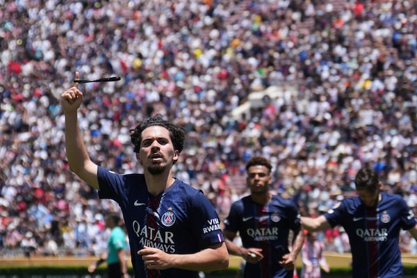 Paris Saint-Germain's Vitinha celebrates scoring his side's second goal during the Club World Cup group B soccer match between PSG and Atletico Madrid in Pasadena, Calif., Sunday, June 15, 2025. (AP Photo/Jae Hong)