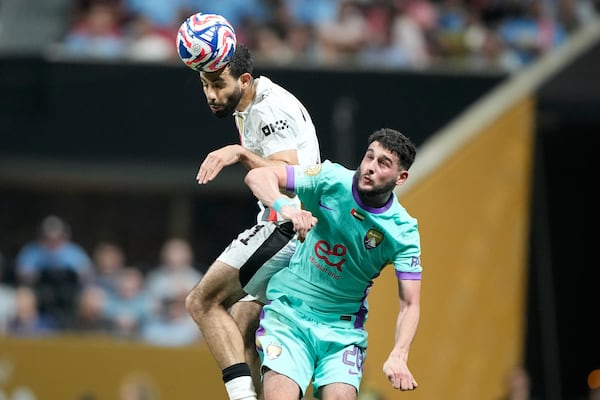 Manchester City's Rayan Ait-Nouri, top, heads a ball next to Al Ain's Nassim Chadli during the Club World Cup Group G soccer match between Manchester City and Al Ain in Atlanta, Sunday, June 22, 2025. (AP Photo/Brynn Anderson)