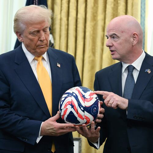 FILE - FIFA President Gianni Infantino, right, presents President Donald Trump with the new FIFA Club World Cup official ball in the Oval Office of the White House in Washington, March 7, 2025. (Jim Watson/Pool Photo via AP, file)