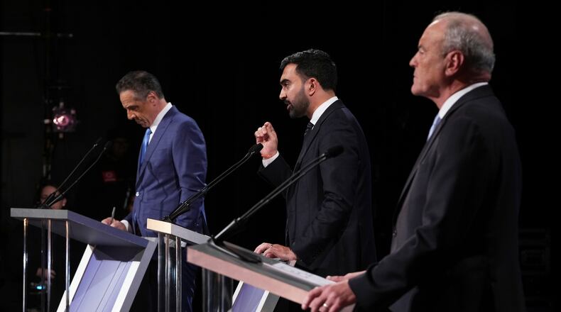 Independent candidate former New York Gov. Andrew Cuomo, Republican candidate Curtis Sliwa and Democratic candidate Assemblyman Zohran Mamdani participate in a second New York City mayoral debate at LaGuardia Performing Arts Center at LaGuardia Community College in the Queens borough of New York, Wednesday, Oct. 22, 2025. (Hiroko Masuike/The New York Times via AP, Pool)