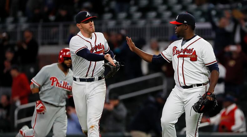 ATLANTA, GA - APRIL 16:  Arodys Vizcaino #38 of the Atlanta Braves reacts with Freddie Freeman #5 after  the final out in their 2-1 win over the Philadelphia Phillies at SunTrust Park on April 16, 2018 in Atlanta, Georgia.  (Photo by Kevin C. Cox/Getty Images)