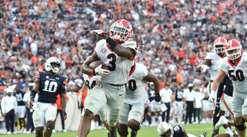 October 9, 2021 Auburn, Alabama - Georgia running back Zamir White (3) celebrates as he scores a touchdown during the second half of an NCAA college football game at JordanÐHare Stadium in Auburn, Alabama on Saturday, October 9, 2021. Georgia won 34-10 over Auburn. (Hyosub Shin / Hyosub.Shin@ajc.com)