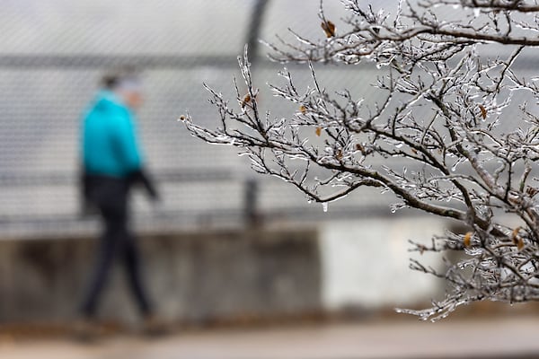 A pedestrian crosses an overpass bridge in the Grant Park neighborhood of Atlanta on Sunday, Jan. 25, 2026, during a break in a winter storm. (Arvin Temkar/AJC)