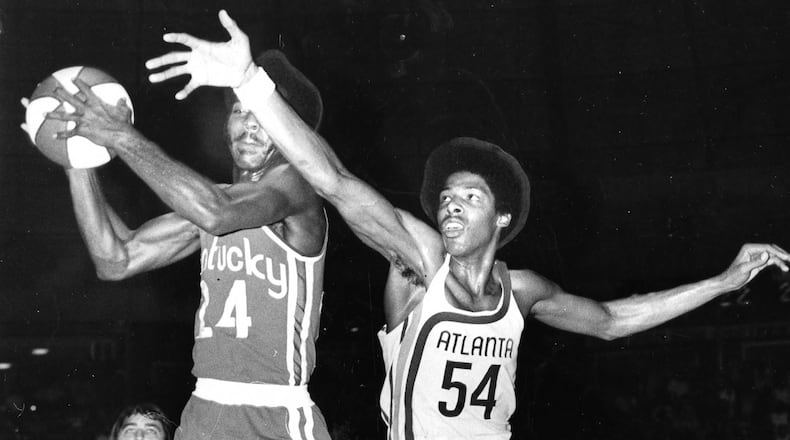 Julius Erving (54) plays for the Atlanta Hawks in an exhibition game on September 1972 against the Kentucky Colonels. Erving signed a contract with the Hawks, giving them a formidable roster that included Pete Maravich, Walt Bellamy and Lou Hudson, but a judge ruled his contract belonged to an ABA team. Erving returned to the Virginia Squires. This rare photo was shot by Chuck Vollertsen of the Atlanta Journal.