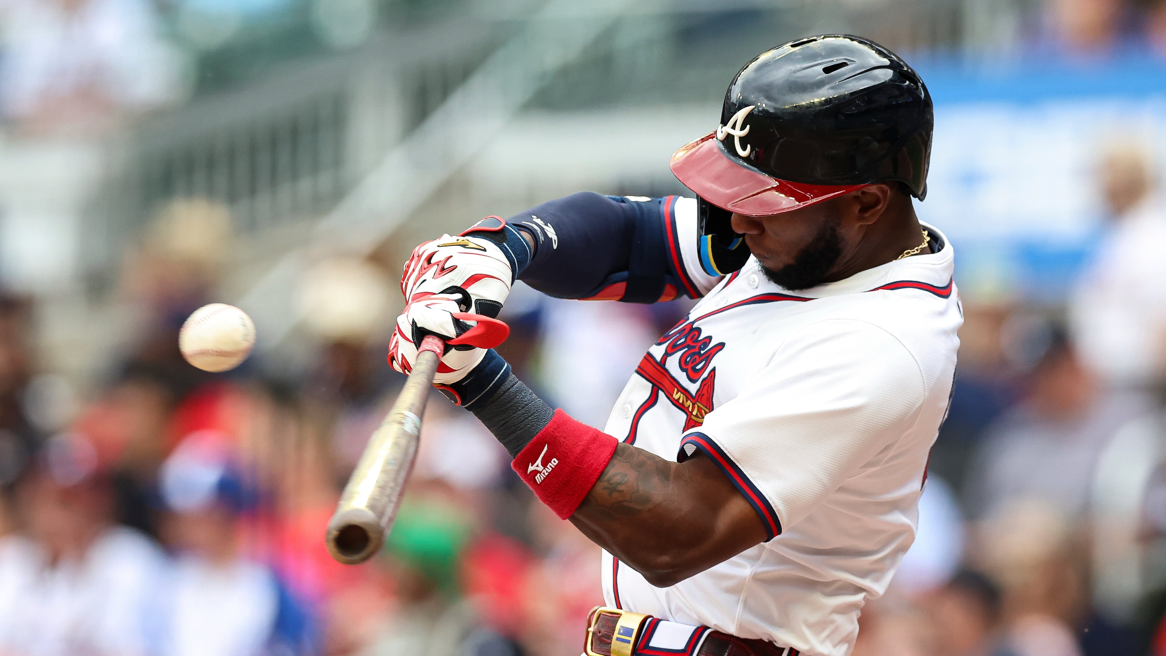 Atlanta Braves' Jurickson Profar hits a single in the seventh inning of a baseball game against the Miami Marlins, Sunday, Aug. 10, 2025, in Atlanta. (AP Photo/Colin Hubbard)