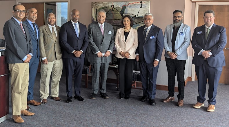 From left to right: Georgia Indo-American Chamber of Commerce (GIACC) board members Amber Mehta and SK Raj; College Park Councilmember Joe Carn; Development Authority of Fulton County Chair Kwanza Hall; Fulton County Commission Chair Robb Pitts; GIACC Chair Grace Multani; GIACC President Jay Joshi; GIACC board member Nick Patel and GIACC secretary Daniel Preston outside of Pitts' office on Thursday, September 19, 2024. Pitts is part of a delegation of Fulton County officials traveling to India in October.