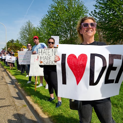 Hundreds protest outside a rally held by President Donald Trump in Warren, Mich., in April. (Dominic Gwinn/TNS)