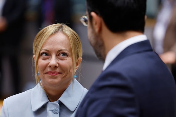 Italy's Prime Minister Giorgia Meloni, left, speaks with Cypriot President Nikos Christodoulides during a round table meeting at an EU summit in Brussels, Thursday, June 26, 2025. (AP Photo/Geert Vanden Wijngaert)