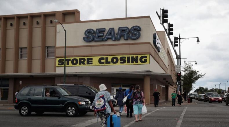 Sears is selling more than a dozen stores in an online auction.