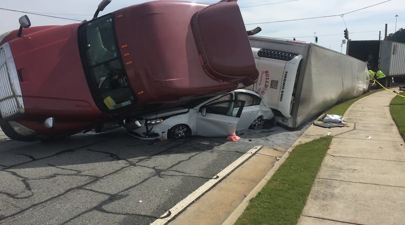 A tractor-trailer nearly crushed this car during a crash in Gwinnett County. (Credit: Channel 2 Action News)